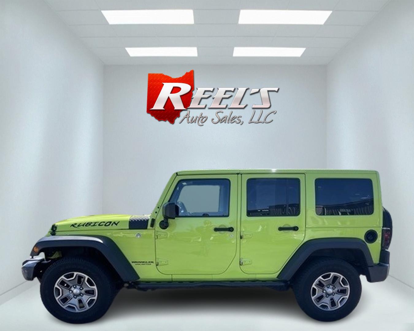 2017 Green /Black Jeep Wrangler Unlimited Rubicon 4WD (1C4BJWFG2HL) with an 3.6L V6 DOHC 24V engine, 5-Speed Automatic transmission, located at 11115 Chardon Rd. , Chardon, OH, 44024, (440) 214-9705, 41.580246, -81.241943 - This 2017 Jeep Wrangler Unlimited Rubicon is a rugged and capable off-road vehicle, equipped with a range of premium features. The exterior boasts LED headlights and fog lights, while the interior features a single-zone automatic climate control system, a 9-speaker Alpine sound system, and navigatio - Photo#9